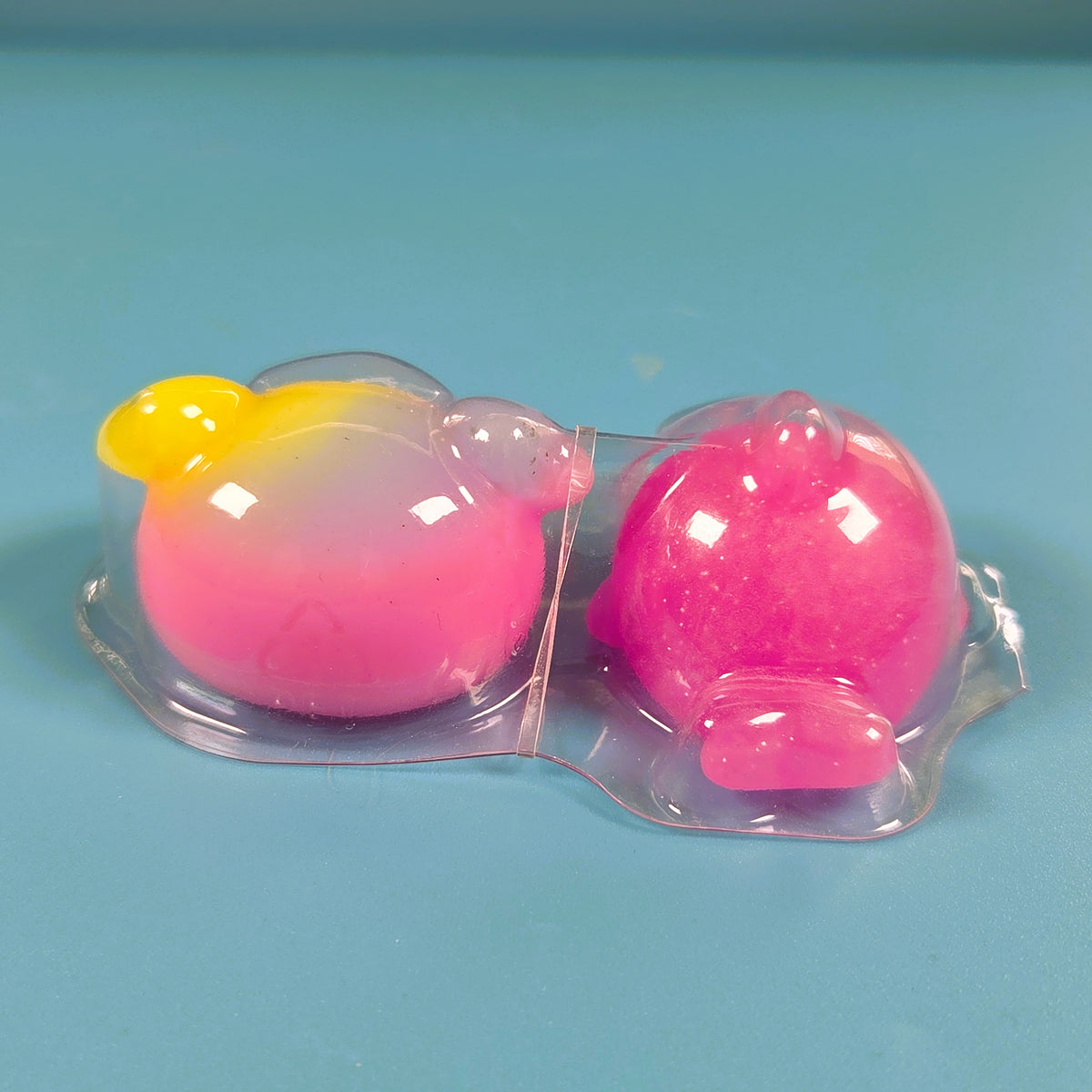 The Original Moj Moj Squish - Pink Glitter Dolphin & Rainbow Crab
